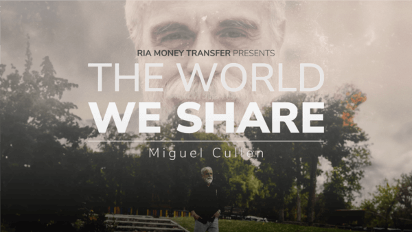 A poster showing an older man with a white beard, his face overlaid above a park scene with trees and stairs. Text reads "RIA Money Transfer presents The World We Share," with "Miguel Cullen" below. The image has a serene, reflective ambiance.